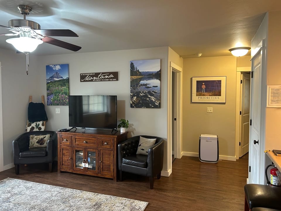 Air purifier in hall leading to bedrooms and bath
