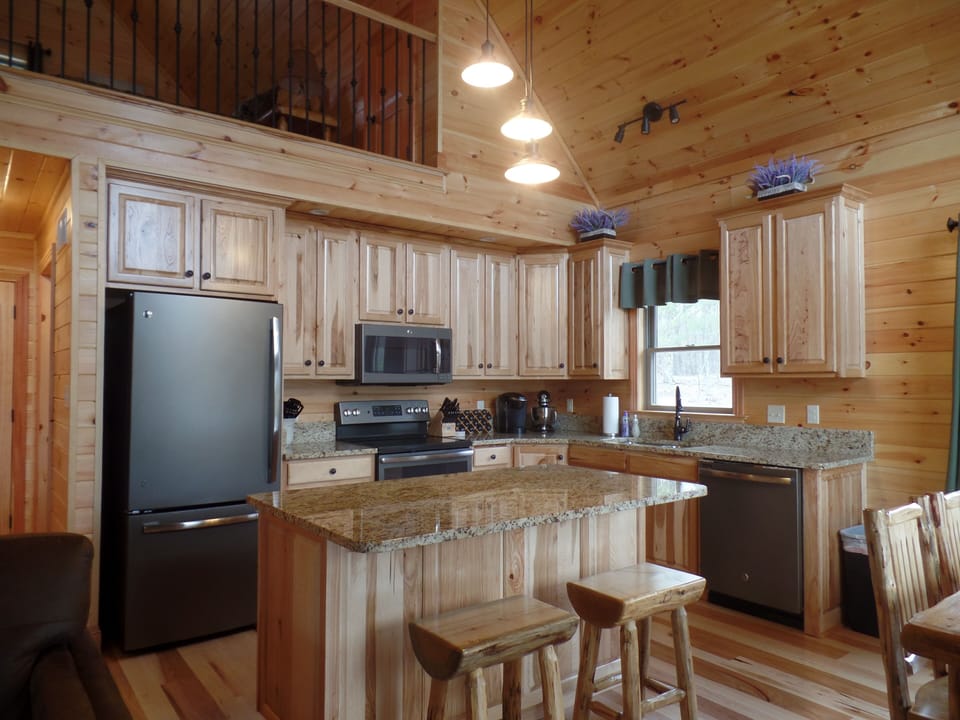Kitchen view with a glimpse of the upstairs loft bedroom