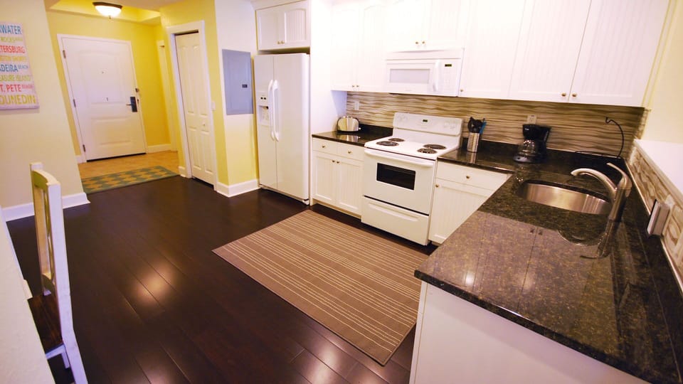 Kitchen - Pic 2 - Full size Samsung washer/dryer to left of the fridge in closet