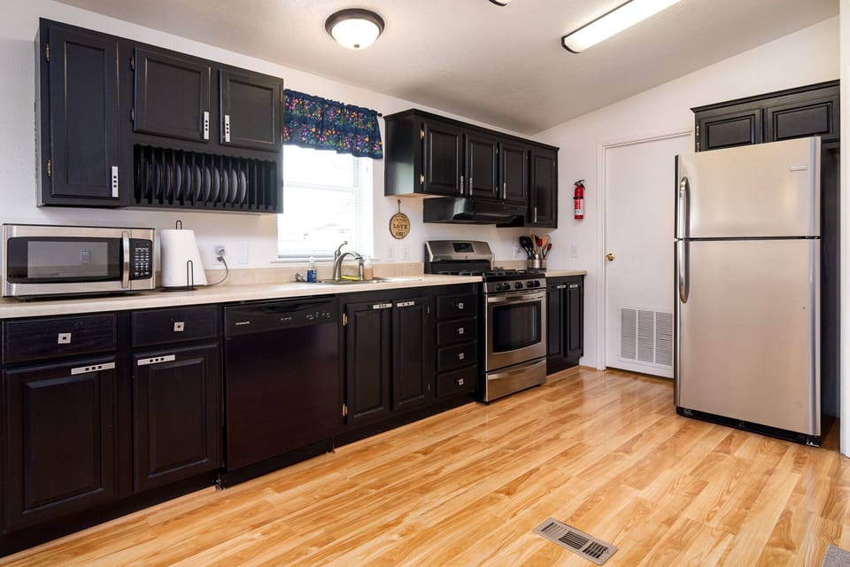 Large kitchen. Stove, dishwasher, microwave and fridge.