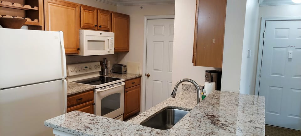 Kitchen with granite countertops and solid wood cabinets