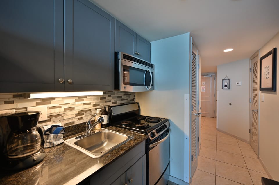 Fully equipped kitchen with granite counters and stainless steel appliances