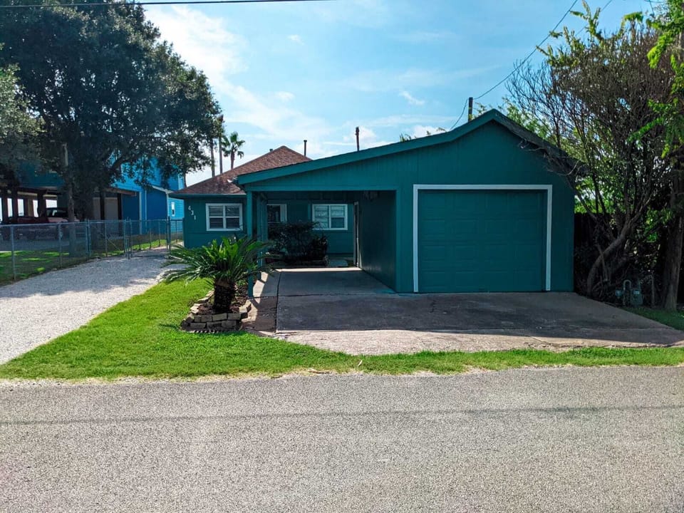 Street view. Ample parking in covered and uncovered driveways 