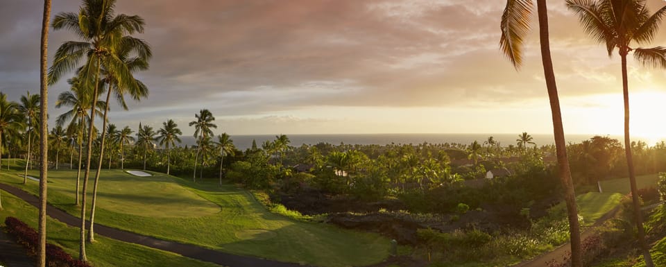 The sun about to set and golf course views.