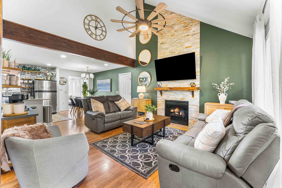Spacious lower level with open floor plan, seating, and gas fireplace.