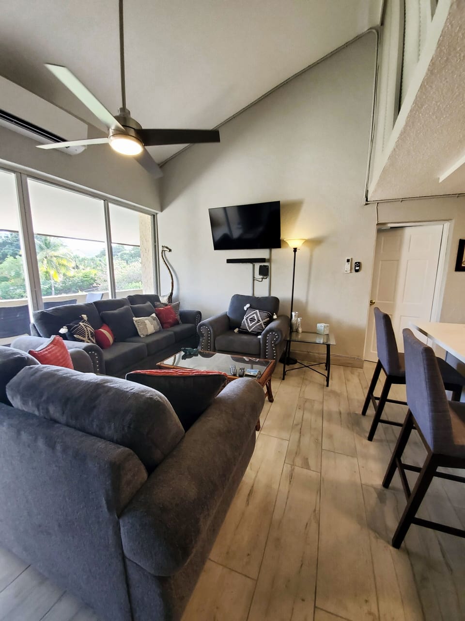 living room with smart TV comfy furniture and AC