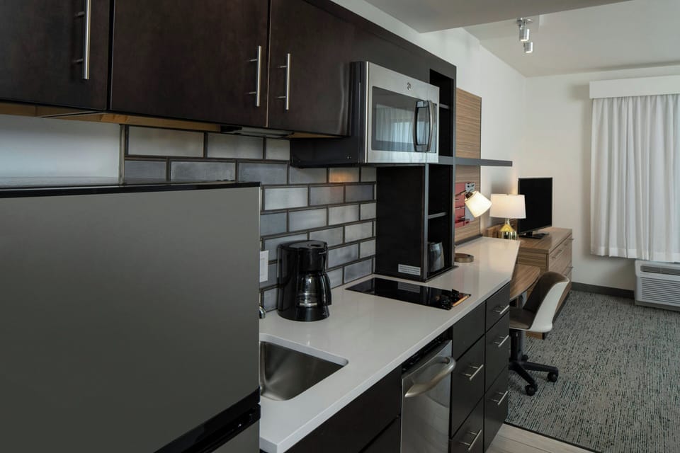 Suite, 1 Bedroom | Private kitchen | Fridge, microwave, oven, stovetop
