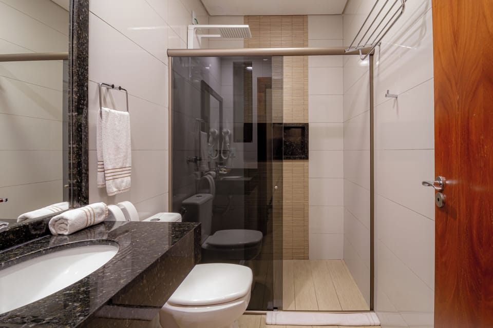 Suite, Private Bathroom (Exterior 2) | Bathroom | Shower, rainfall showerhead, free toiletries, towels
