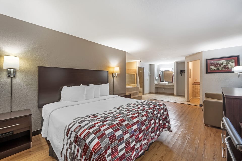 Suite, 1 King Bed, Smoking, Jetted Tub | Desk, laptop workspace, blackout drapes, free cribs/infant beds