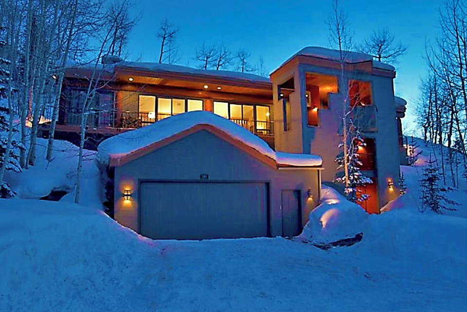 Evening View of Garage, Elevator Tower and Main Level