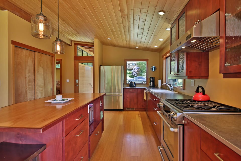 Well equipped kitchen with variety of cooking and eating utensils. 