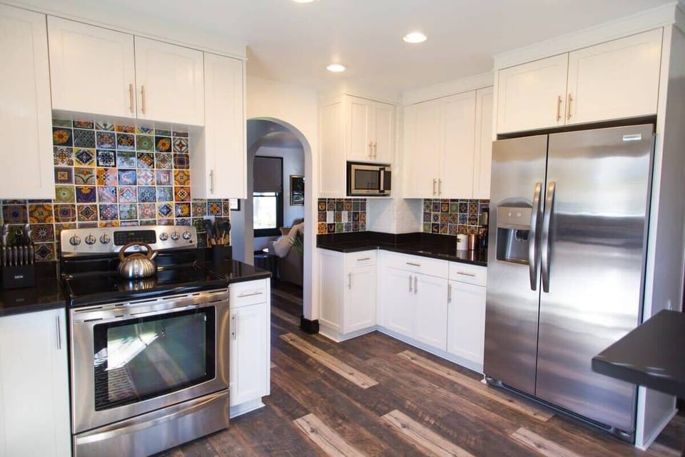 Main House: Beautiful spacious kitchen, stocked with cookware essentials, coffee machine, and all stainless steel appliances.