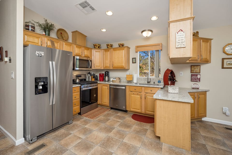 Bright functional full kitchen with most small appliances