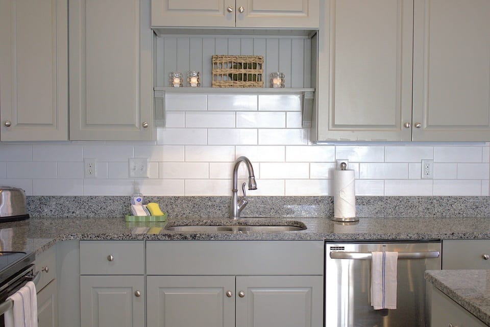Stainless steel sink, dishwasher, microwave, fridge and freezer, and stovetop oven combo. This house has it all.