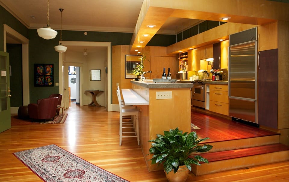 Fully stocked gourmet kitchen with bar.