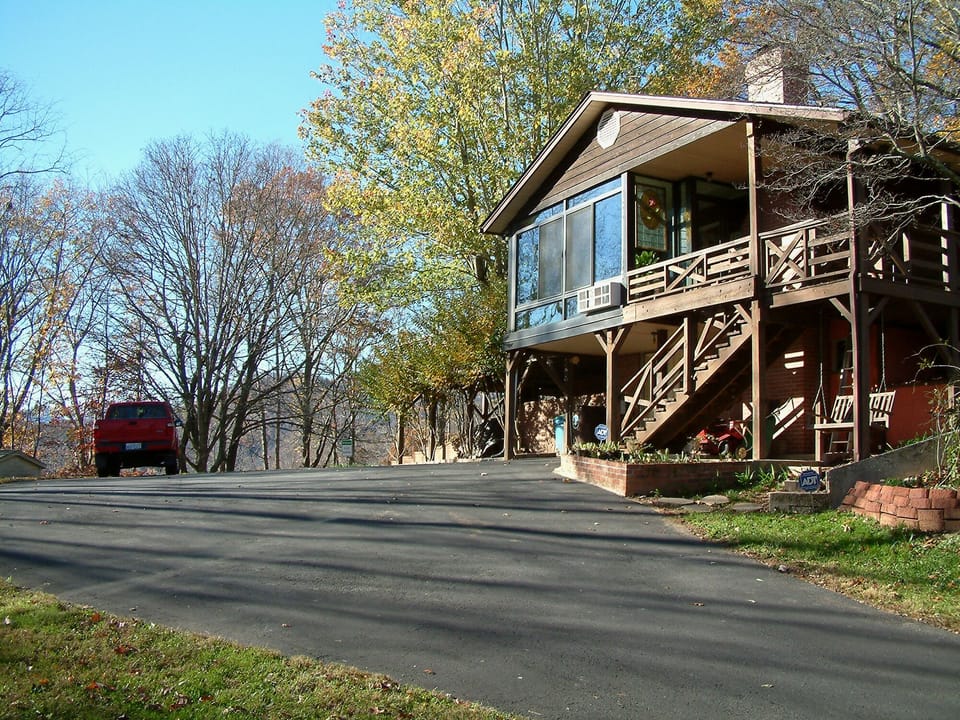 The house at the top of the driveway.  Your parking area is on the right.  