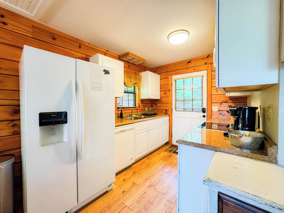 Small and efficient kitchen fully equipped with all basic cooking utensils