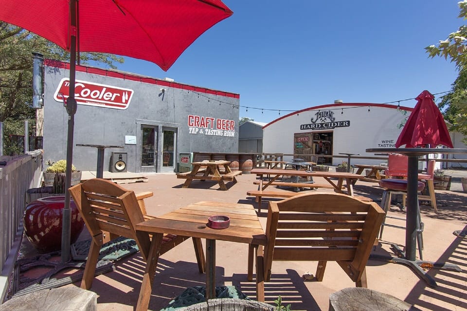 View of The Cooler Craft Beer patio and the main Julian Station building.