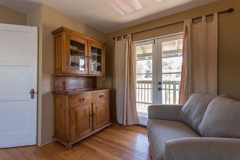 French doors in master bedroom lead to veranda.
