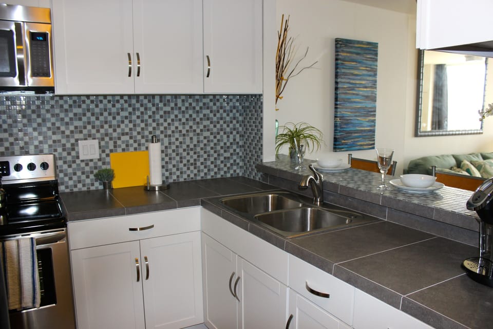 Brand new appliances, cabinets and counter tops
