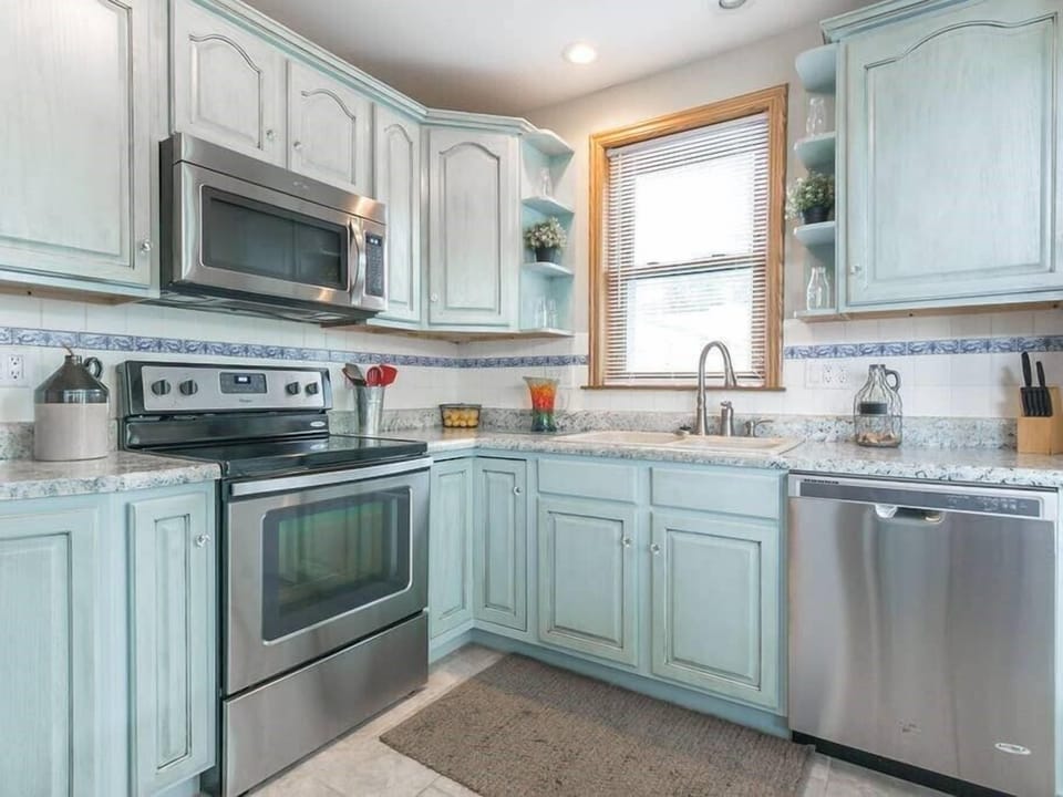 Kitchen with hand painted shabby chic cabinets