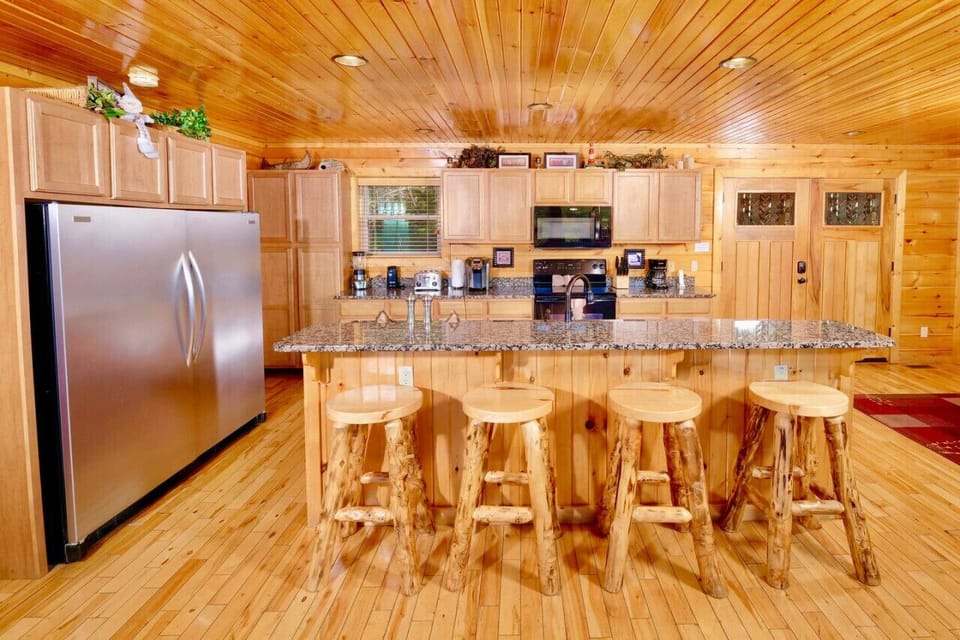 There is additional seating at the kitchen island near the Aspen table