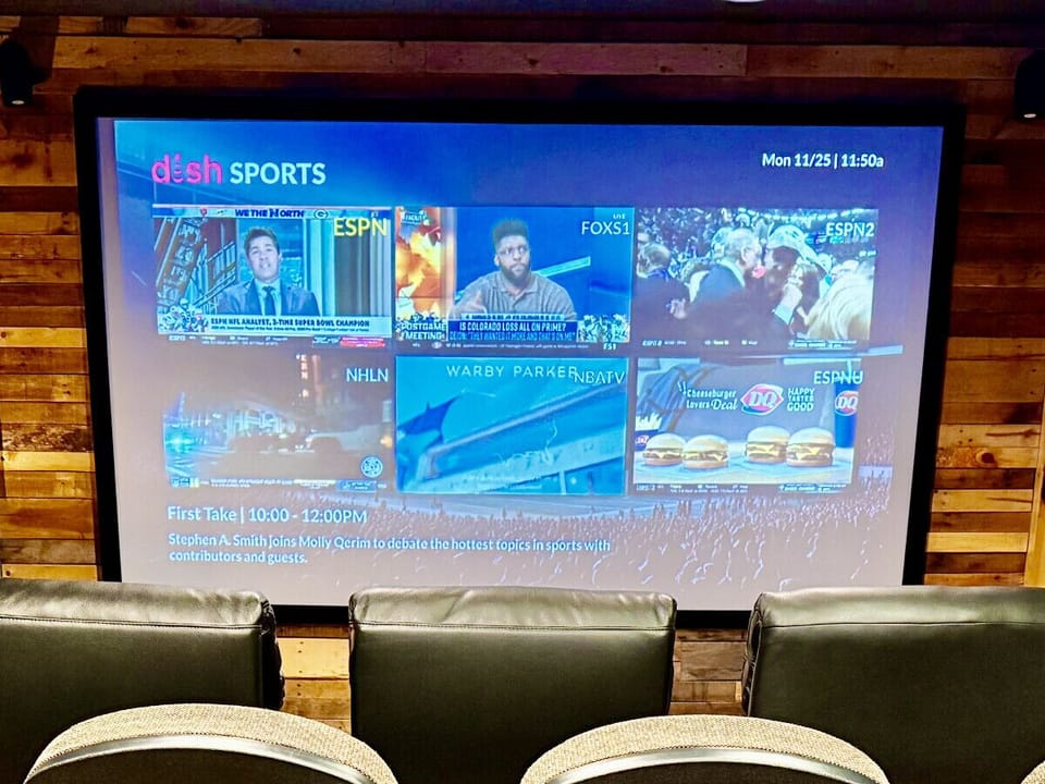 You can watch 6 sports game/channels at the same time on the 120 inch screen with a pallet wood feature wall.