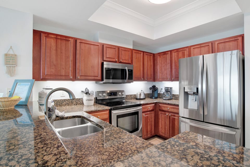 After relaxing on the beach, cook your meals in this fully stocked Kitchen