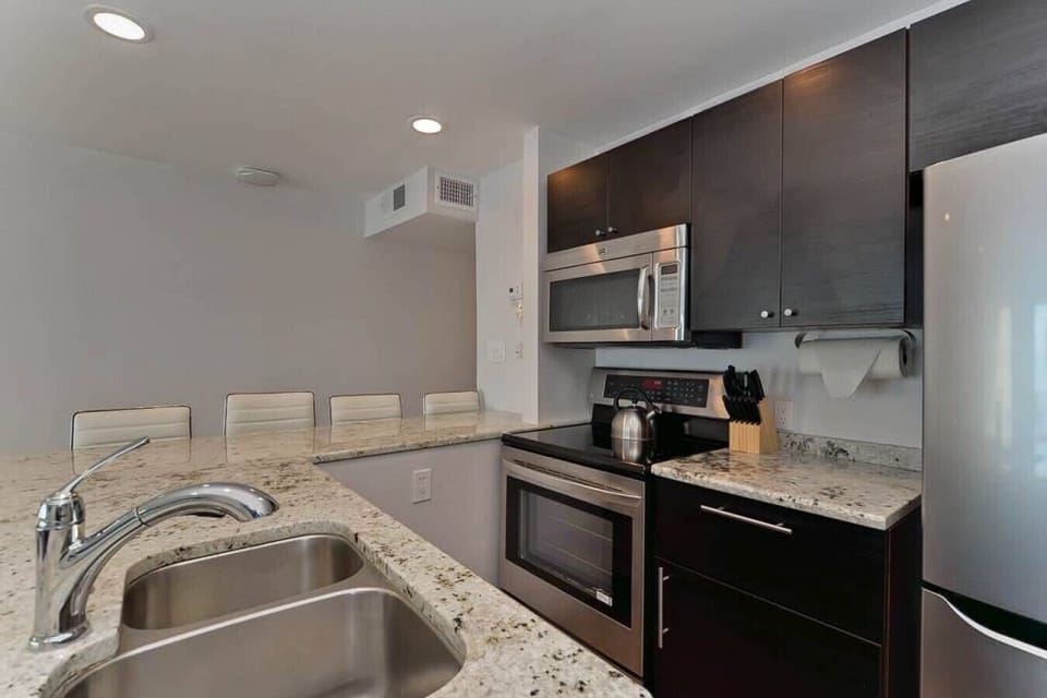 Modern Kitchen: Sleek countertops and stainless steel appliances invite culinary creativity!