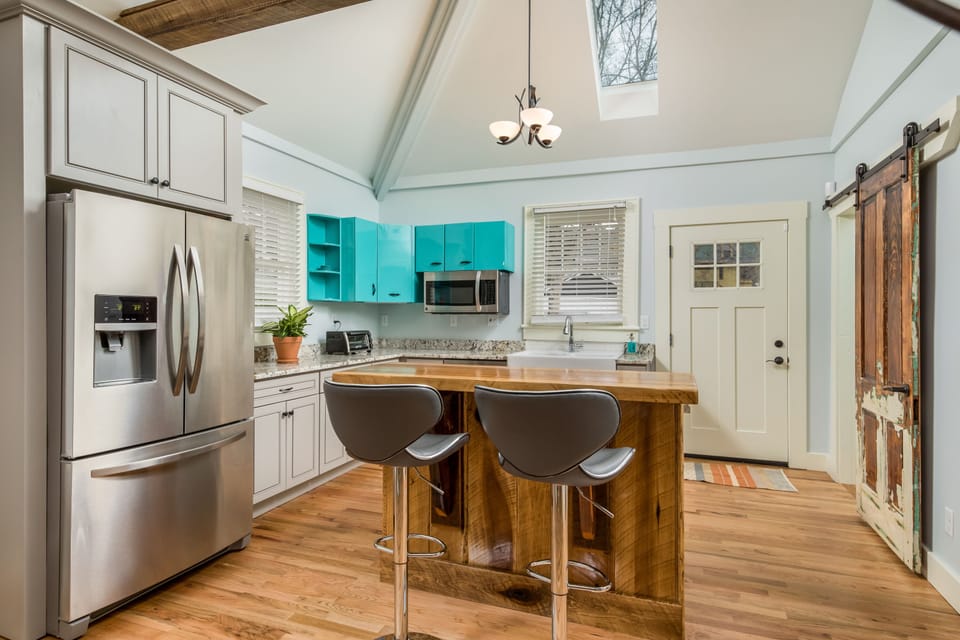 The Kitchen has Stainless Steel Appliances and is Stocked with Cooking Basics