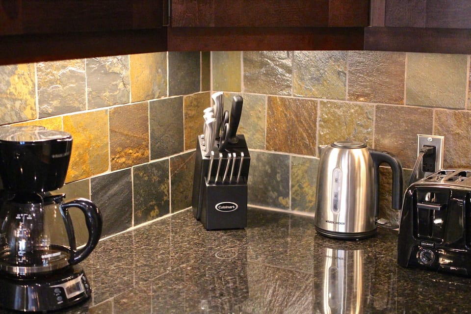 Coffee maker, tea kettle, toaster and other small appliances are here to use.