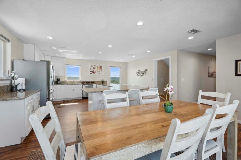 Oceanfront kitchen with island seating and panoramic beach views. 🌊🍽️