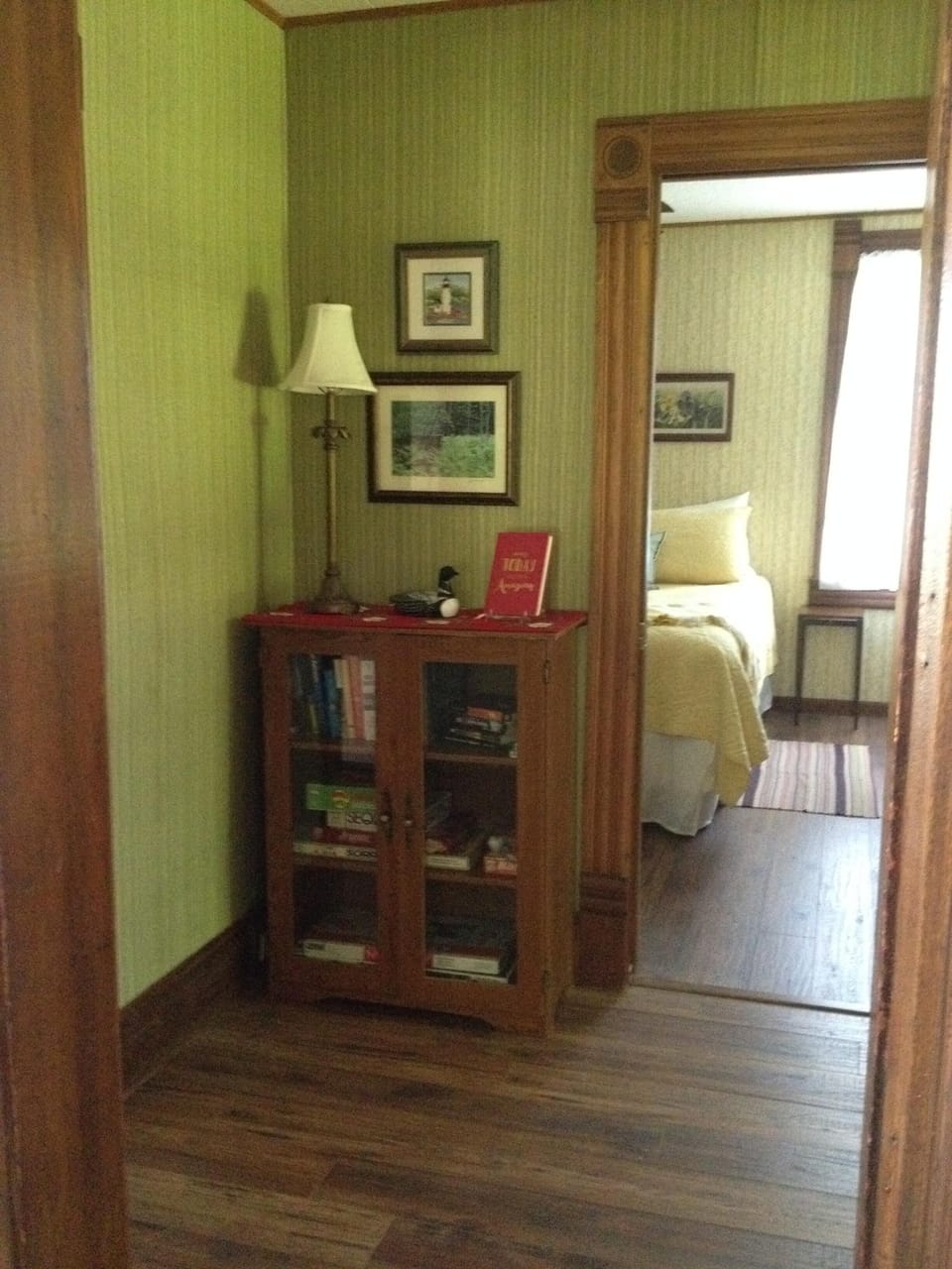 Hallway view into 1st floor Queen BR with attached bath.Games &  books to enjoy!