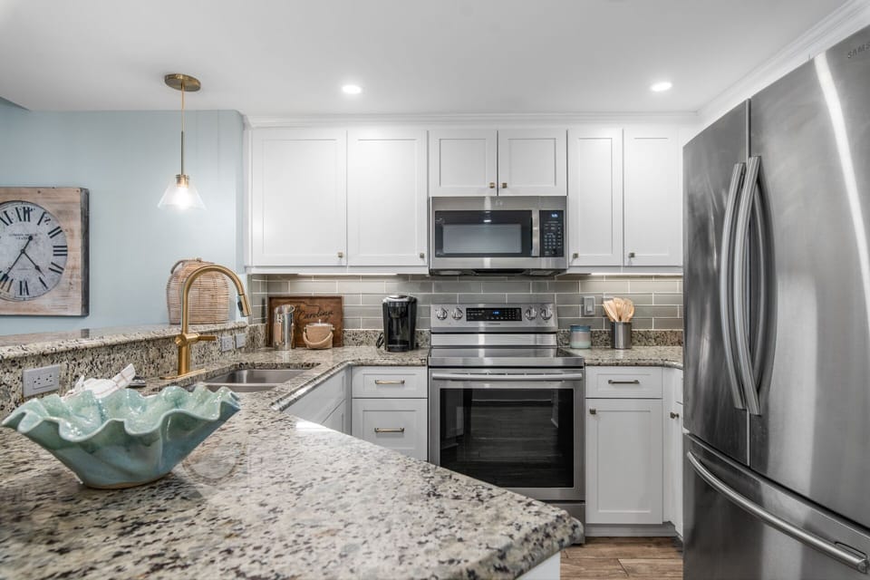Updated kitchen with clean finishes and modern coastal feel
