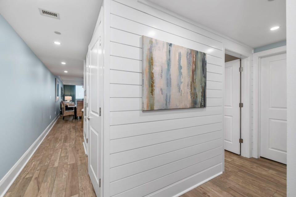 Bright, open hallway connecting bedrooms and main living space