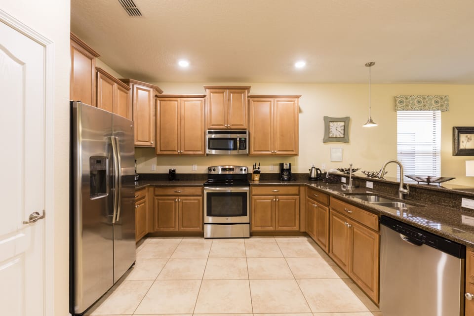 Full functioning kitchen with stainless appliances and icemaker