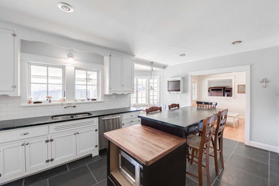 Kitchen bar as second eating area.  Kitchen overlook pool.
