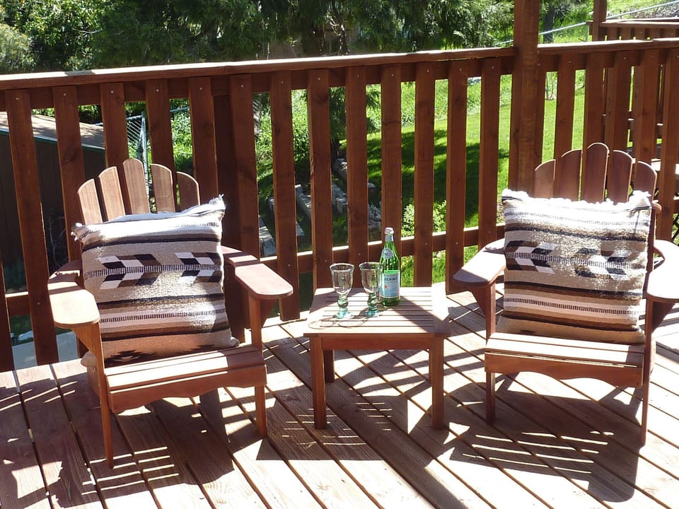 The balcony wraps around  the house is perfect for bird-watching