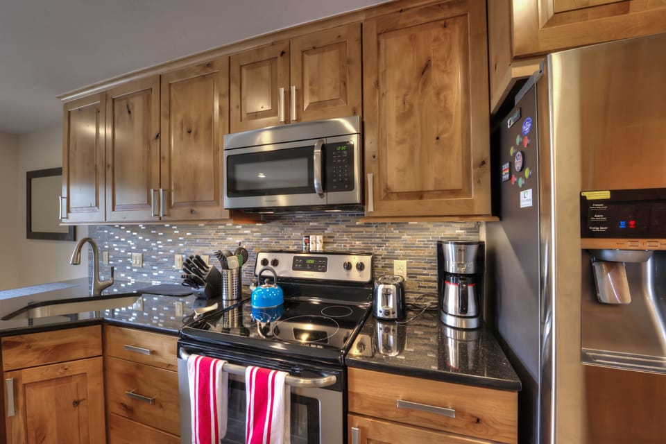 Beautiful custom cabinets and fully stocked kitchen