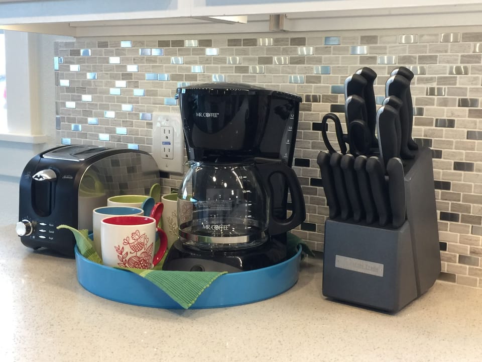 Coffee Maker, Toaster,  and Basic Utensils for a simple meal.