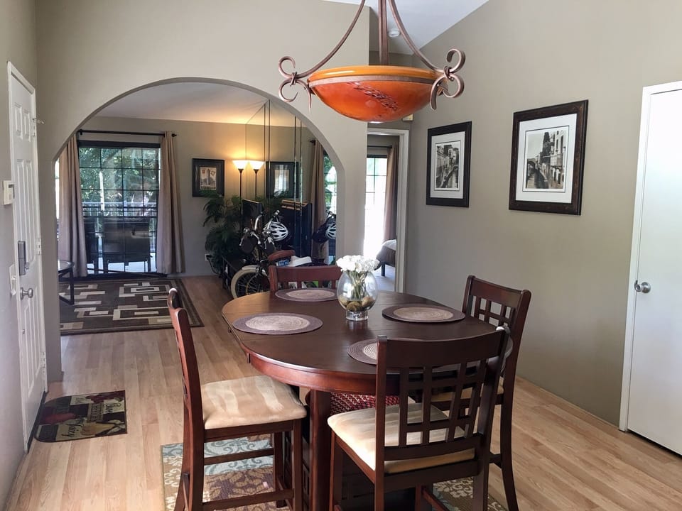 Brand new dining table serving 4 people. And a new lamp over the table.. 
