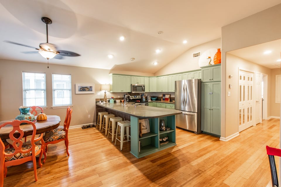 The kitchen features great work and dining space.