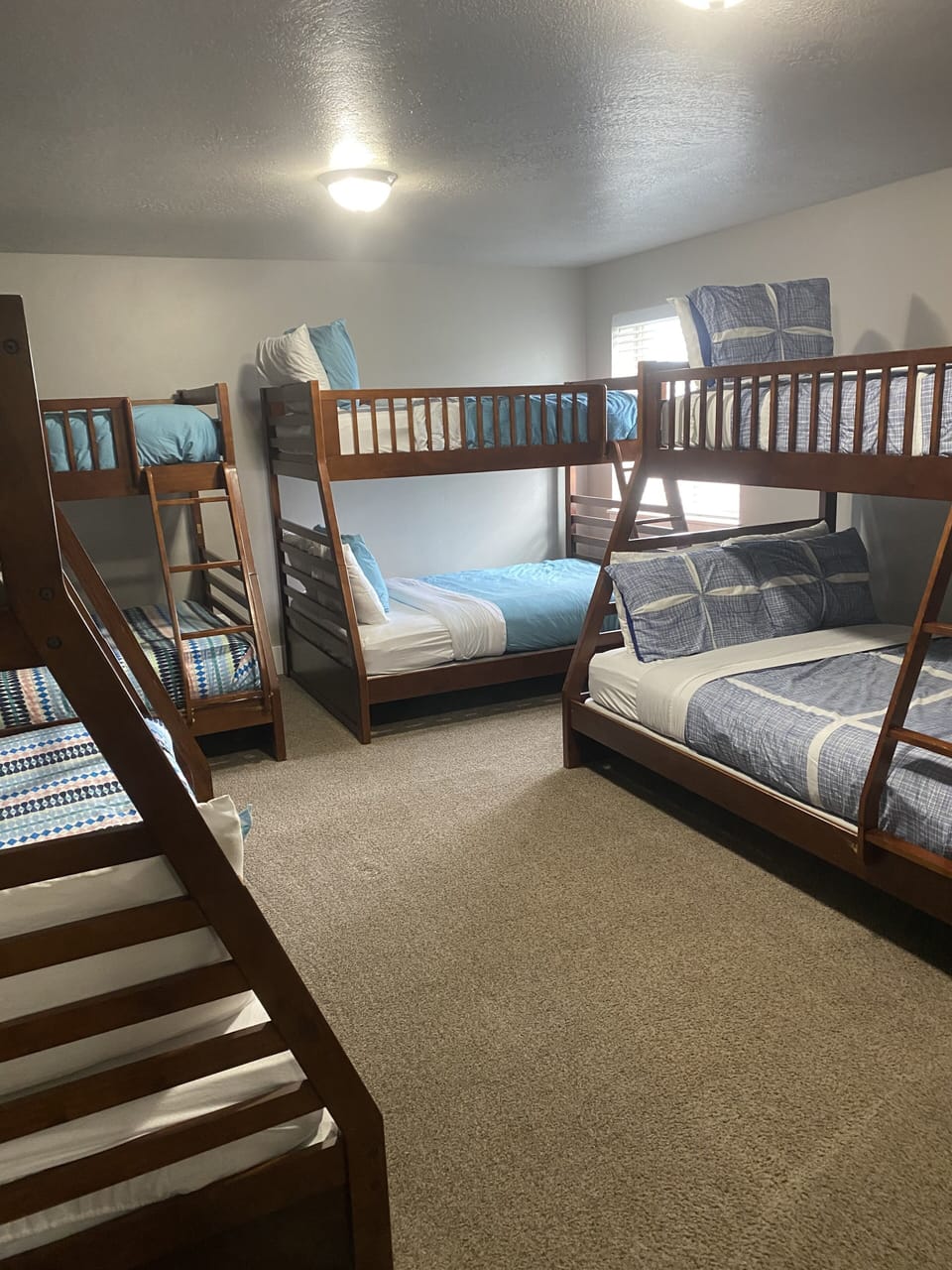 Basement bedroom with 4 twin over full bunkbeds