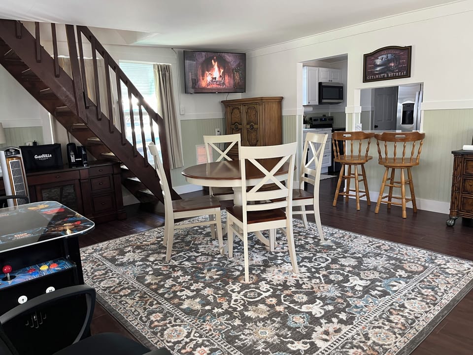 Game room- steep stairs leading to a king bedroom & queen w/adjoining halfbath