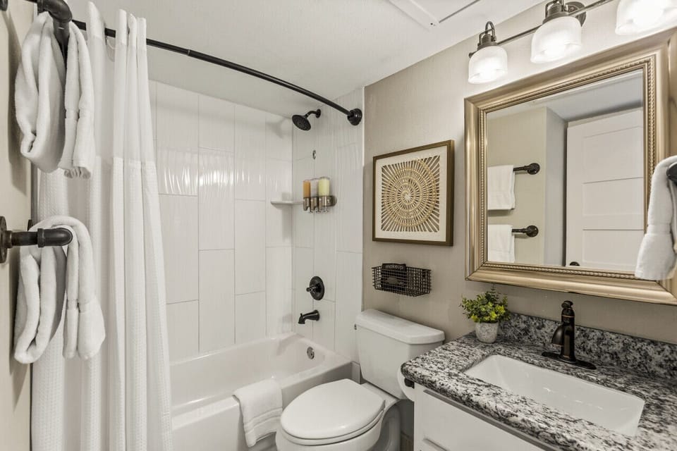 Relax and refresh in this beautifully designed bathroom with plush towels and modern decor.