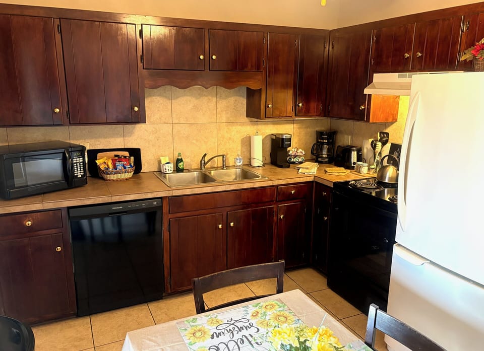Fully stocked kitchen with coffee maker and a Keurig single cup + starter coffee