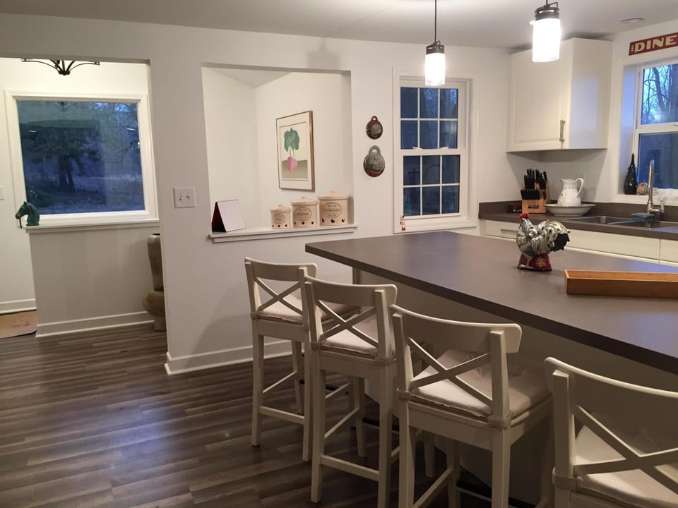 Fully stocked kitchen with all you need to create a meal. Island with 4 stools.