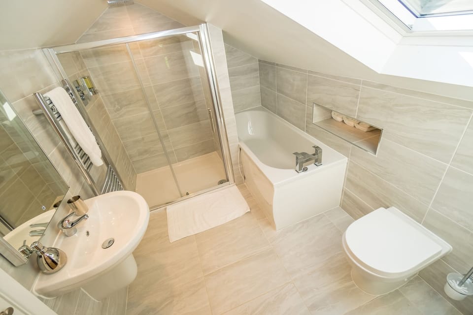 The upstairs bedroom ensuite has both a bath and shower.
