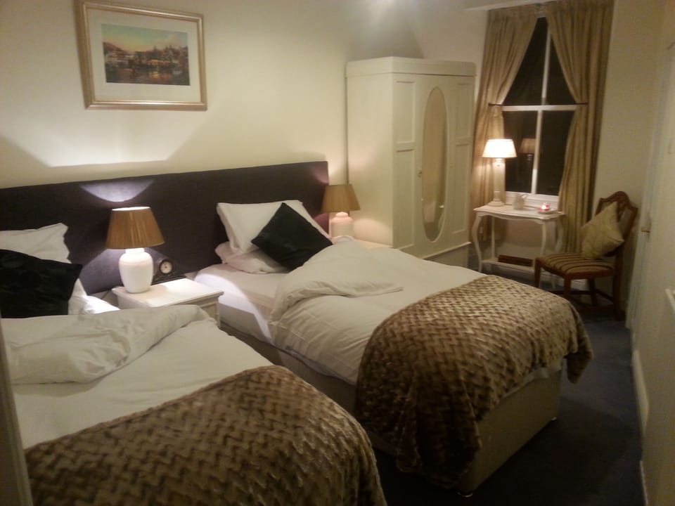 Dressing table is placed by the window offering lots of light. Plus a hairdryer is available for guests use.