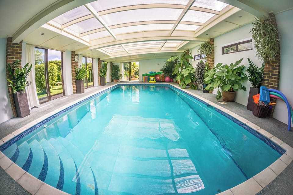 Heater indoor swimming pool with lots of inflatable toys
